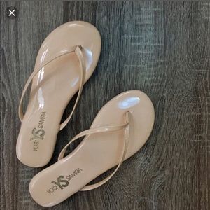 Nude patent leather flip flops